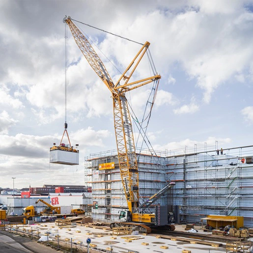 A lattice crawler crane with an A-frame.